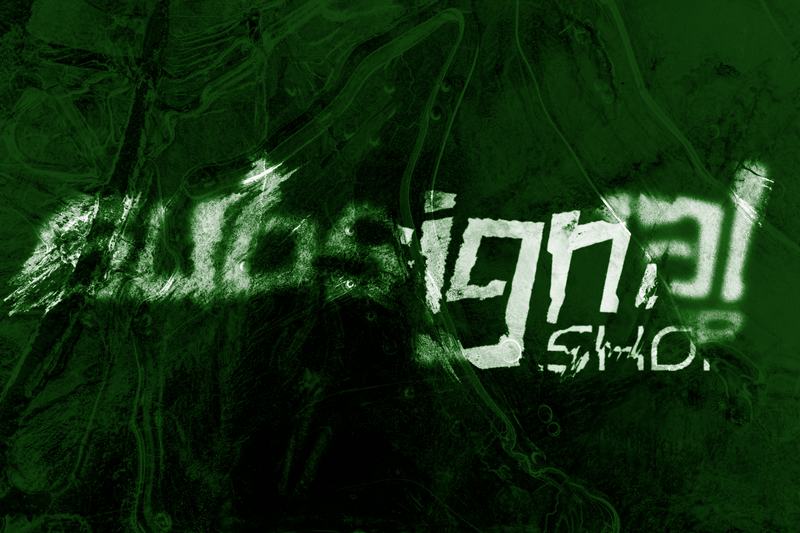 The wordmark scratched into dark green rock